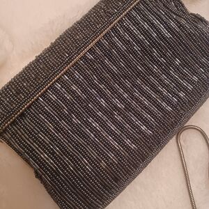 Elegant Vintage Black Clutch with Ribbed Texture and Metallic Sheen